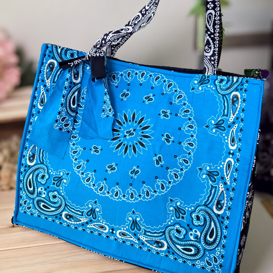 Blue bandana-patterned tote bag on a wooden surface